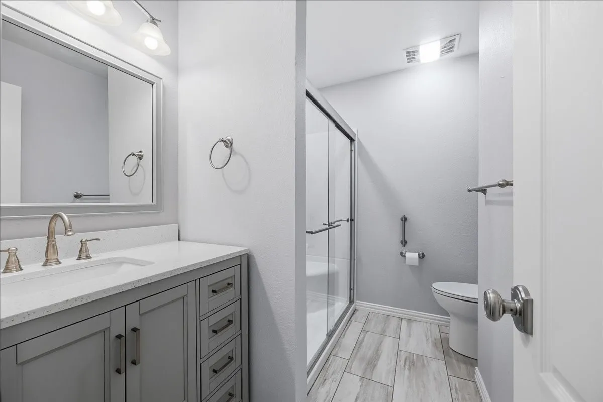 Bathroom with vanity and a stall​​‌​​​​‌​​‌‌​‌‌​​​‌‌​‌​‌​‌​​​‌​​ shower