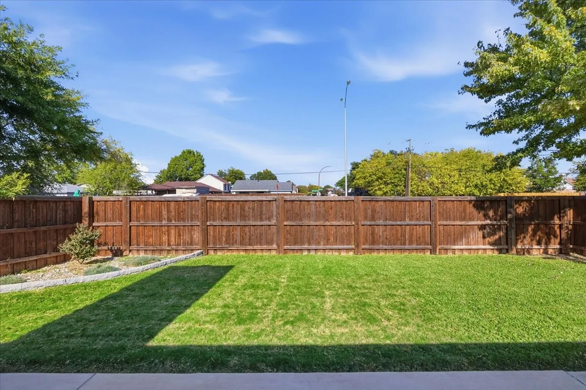 View of fenced backyard