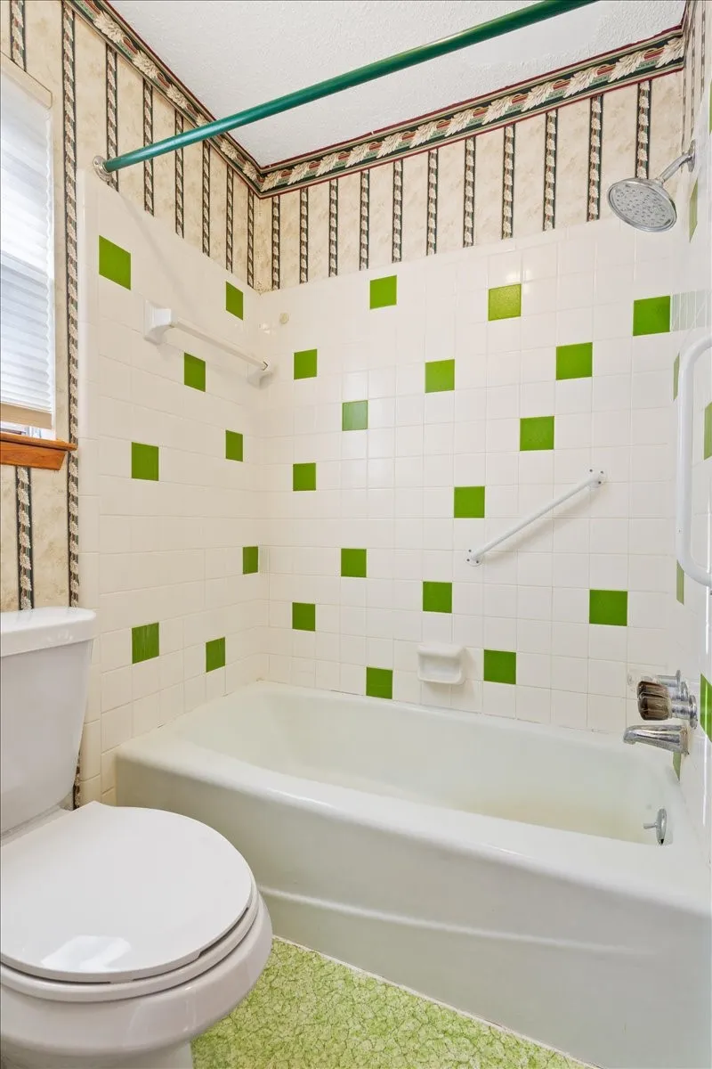 Full bath featuring tub / shower combination and toilet
