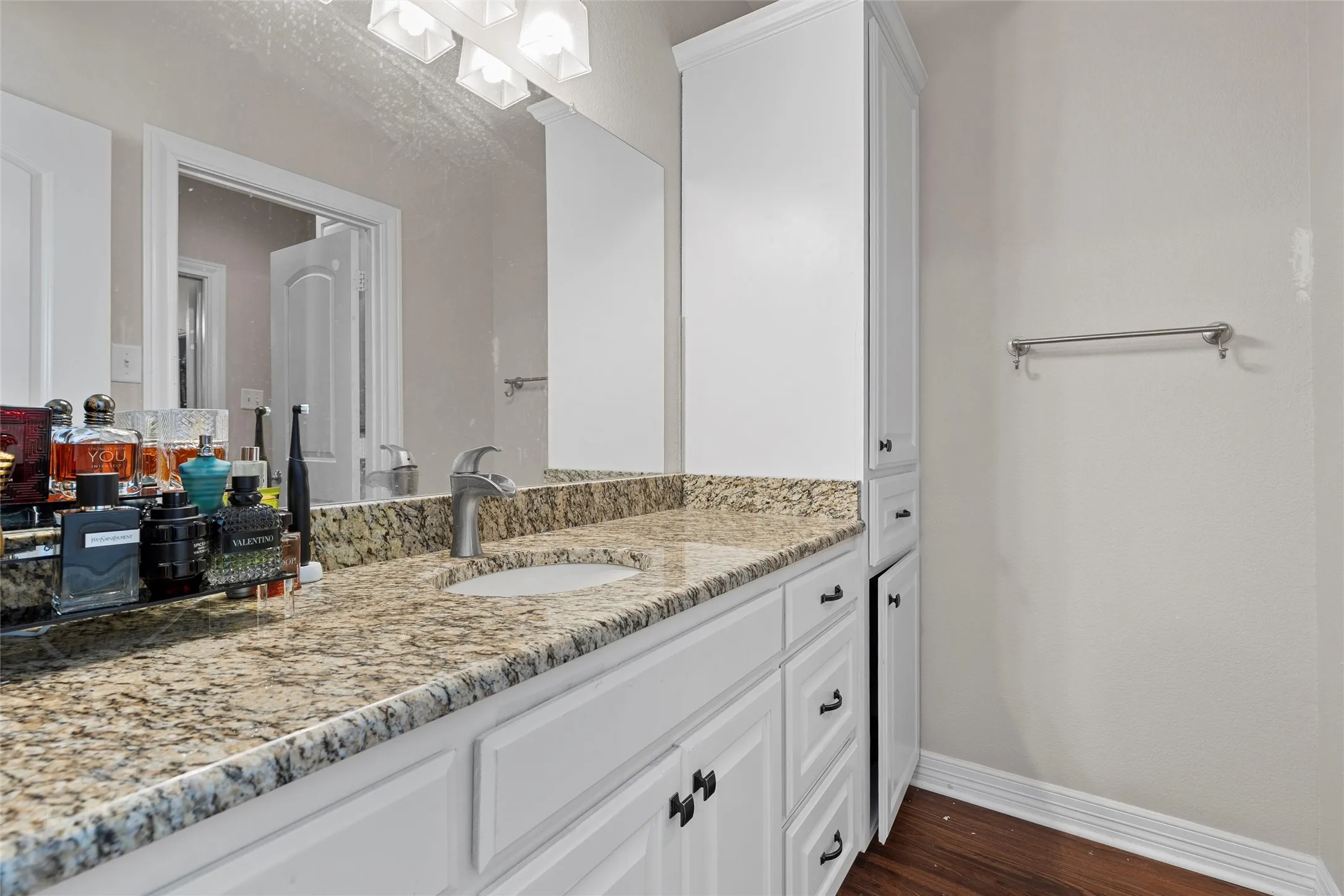 Bathroom with vanity and dark wood finished floors