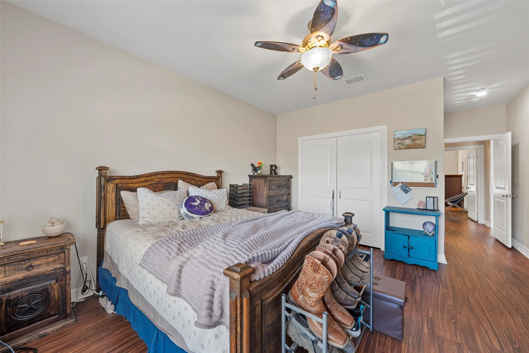 Bedroom #2 featuring dark wood-style flooring, a closet, and a ceiling fan