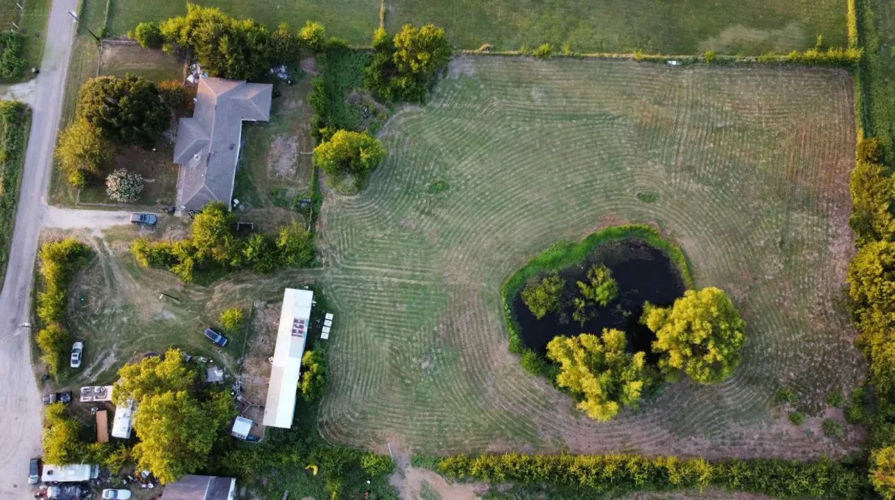 Aerial view of property and surrounding area with rural landscape and extensive farmland