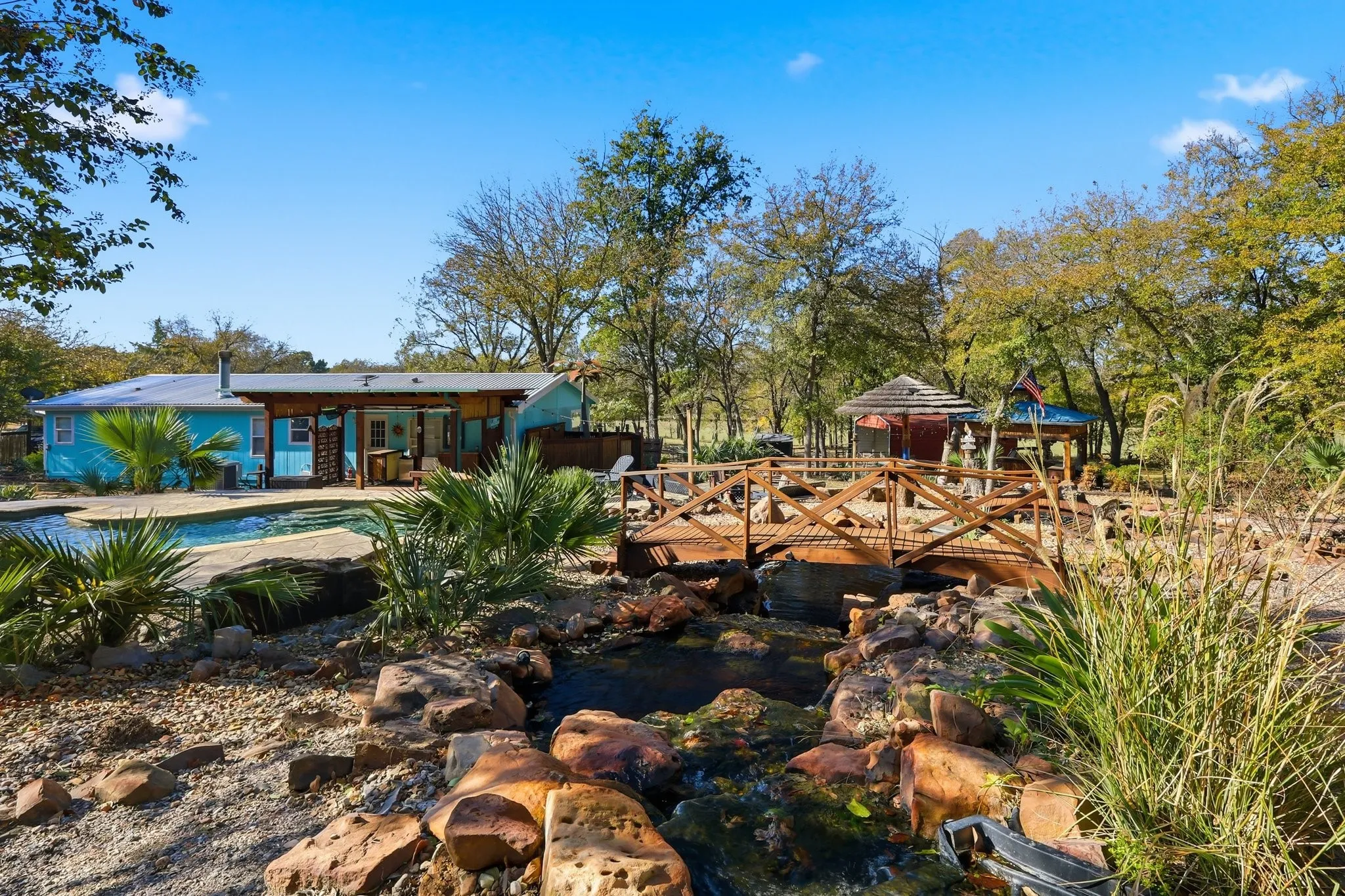 Scenic Views, Beautiful Terrain, Higher Elevations, Mature Trees, Seasonal Pond, Unique Features, 9 Foot Deep Diving Pool, Koi Pond, This 11 Acres Has It All! Covered Back Pergola and Composite Decking. Full Gutters with Leaf Guard.