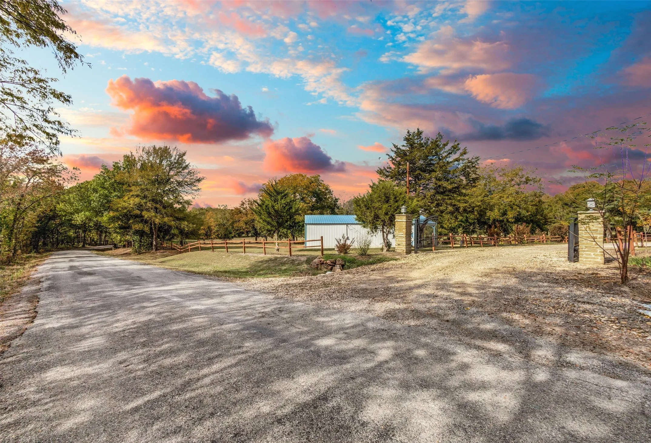 A Long Tree Lined Road Welcomes You Home. Opening to the Gated Entrance of this Peaceful 11 Acre Estate.