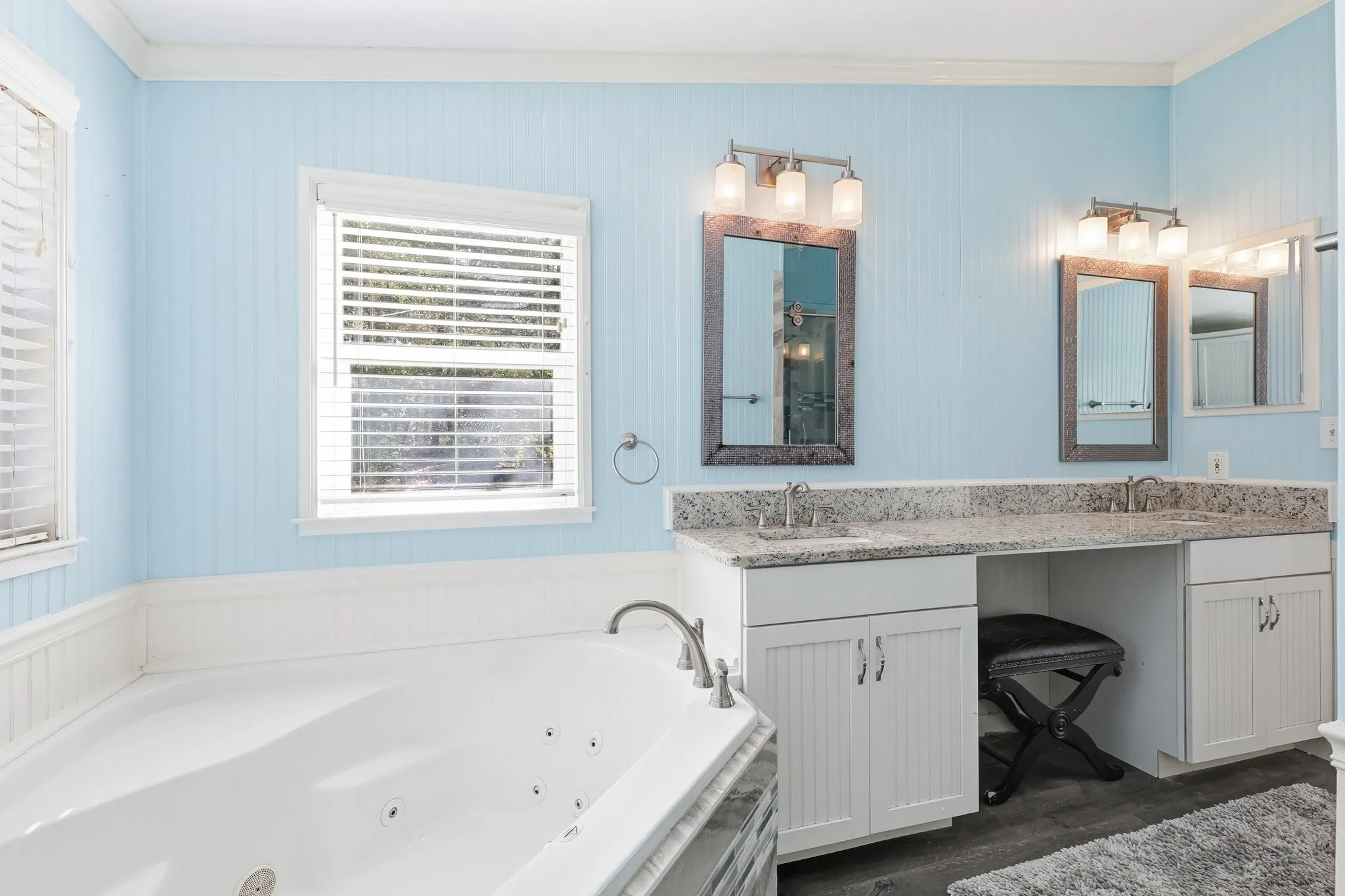Jetted Soaking Tub, Dual Sinks, and a Spacious Vanity Area in the Primary Bathroom.