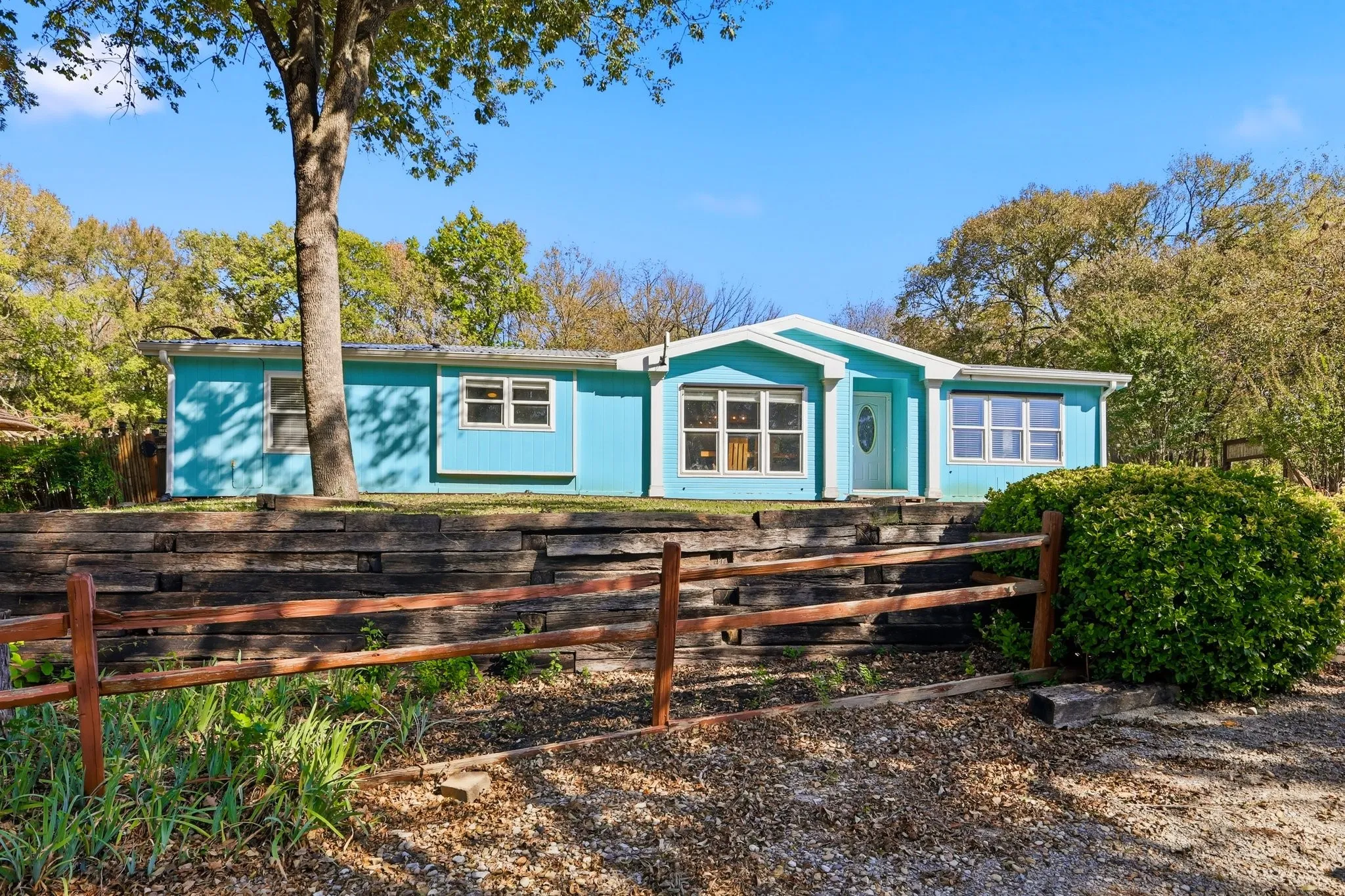Charming 3 Bedroom, 2 Bathroom Home Framed By Shade Trees and Natural Landscape. Palm Harbor Home with Tie Downs on an 11.27 Acre Private Park. Make This Your Homestead, a Pool House to a Larger Custom Home, or a Mother-in-Law Suite. Plenty of Options Here.