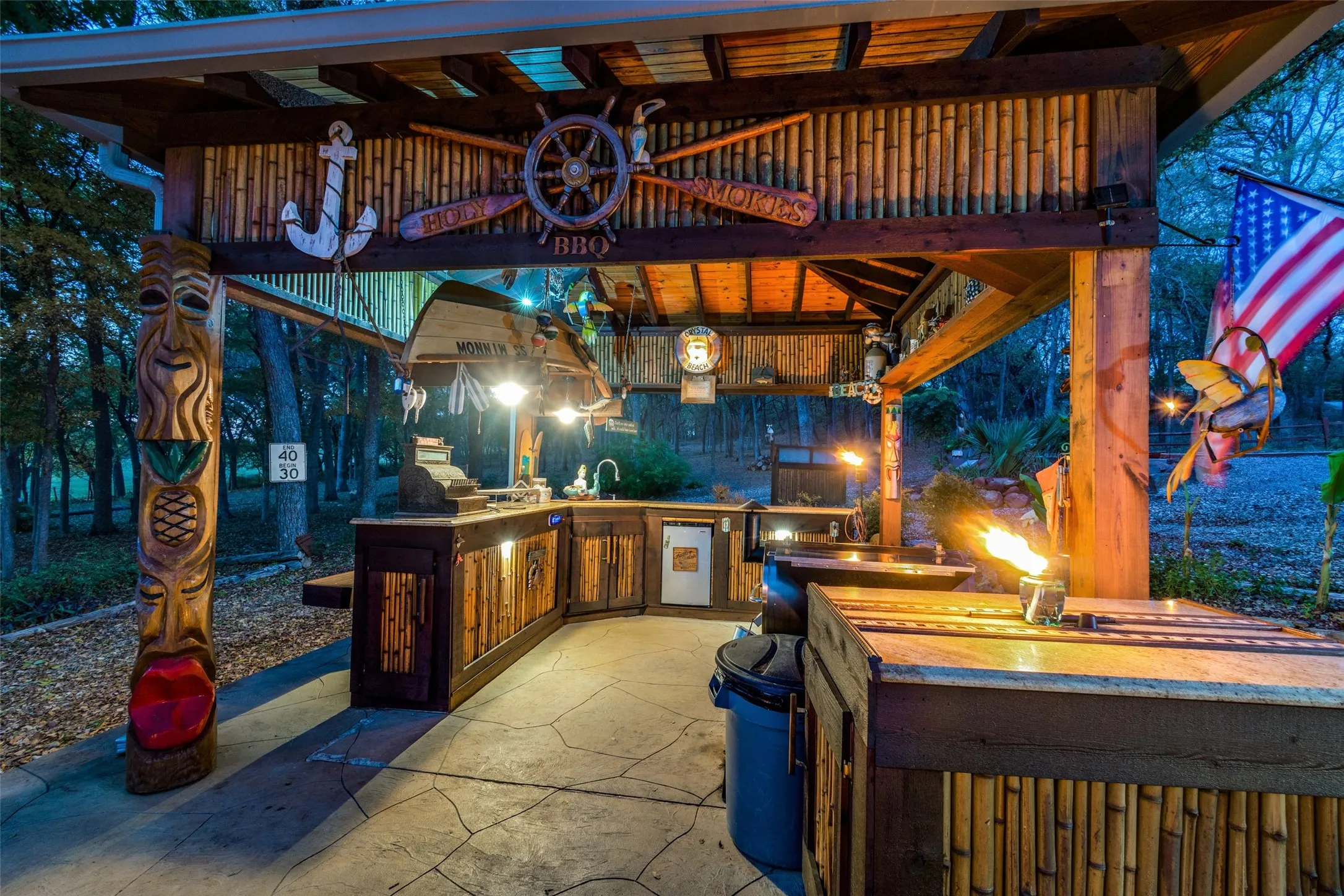 Custom Carved Tiki Totems and Decorative Canoe, Bring Island Themed Craftsmanship to Life Throughout the Property.