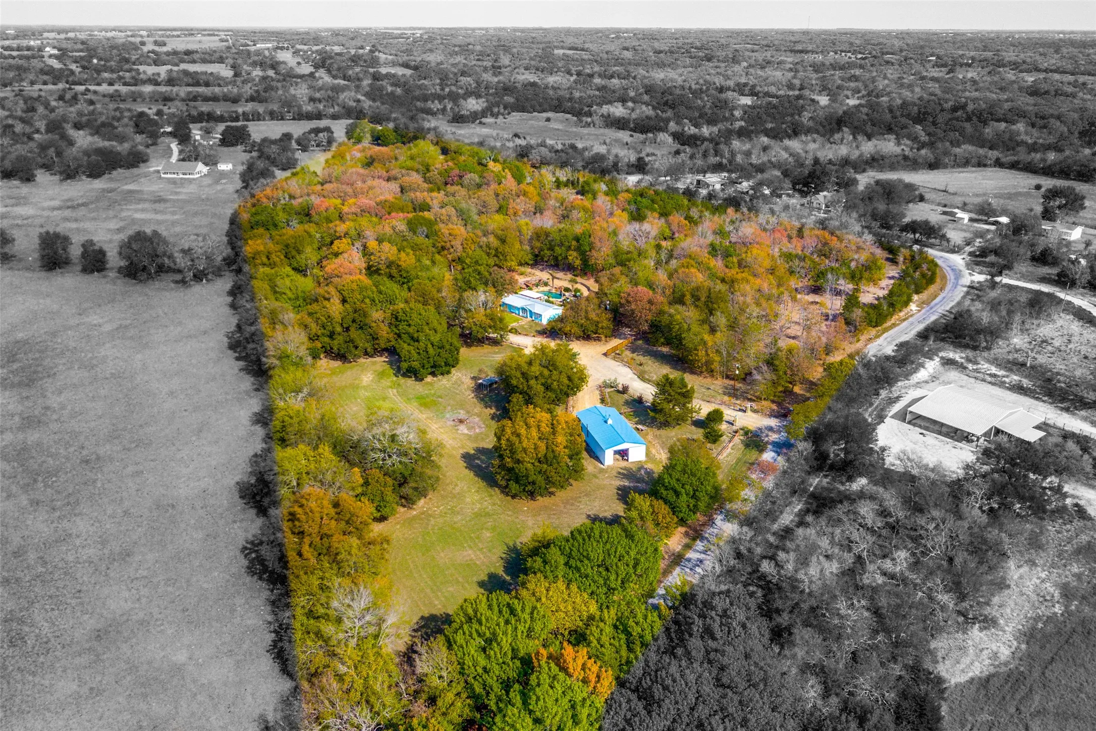 11.27 Acres, a Charming 3 Bedroom Home, Pool, Outdoor Shower, Workshop with Fireplace, Tiki Bar, Outdoor Kitchen, Koi Pond, Tornado Shelter, Carport, RV Parking, Site For Future Pond with Existing Dock + Seasonal Pond in the Back, Higher Elevations, Mature Trees, Electric Gate, with Room For Expansion. Perfect For a Family Compound or Investment Property.