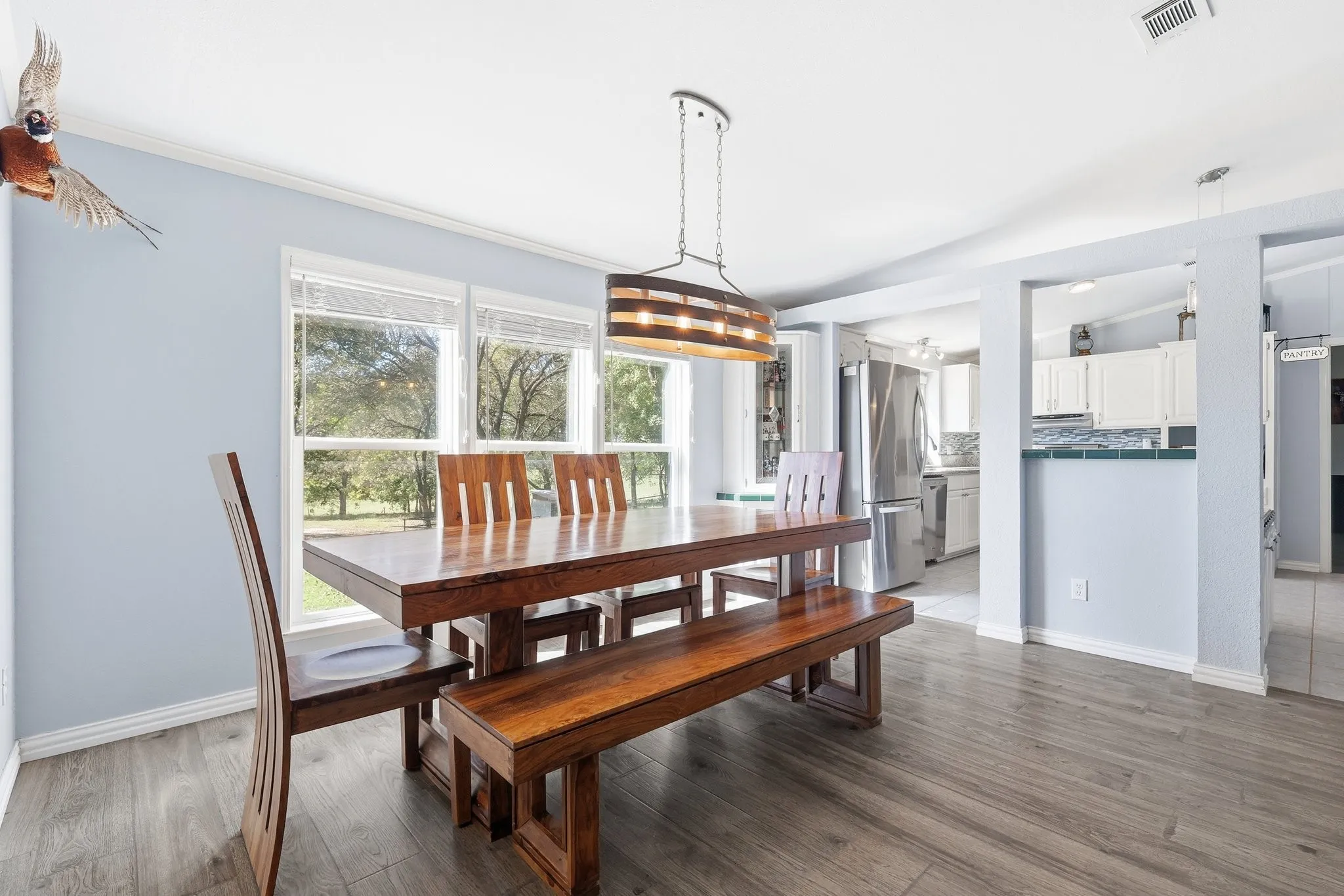 What a View! Large Dining Space with Room For an Oversized Table. A Full Wall of Windows Frames the Outdoors and Brings Nature Right into the Home. Sometimes You See Deer Meandering By.
