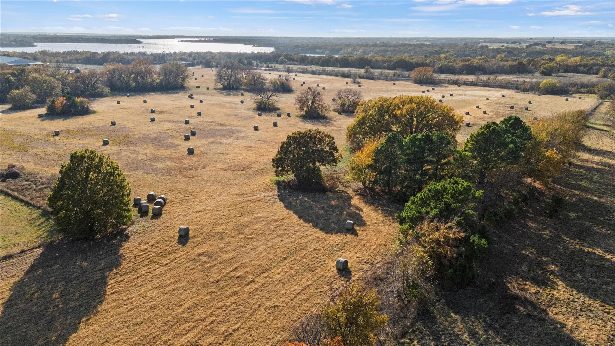 Aerial overview of property's location with a nearby body of water