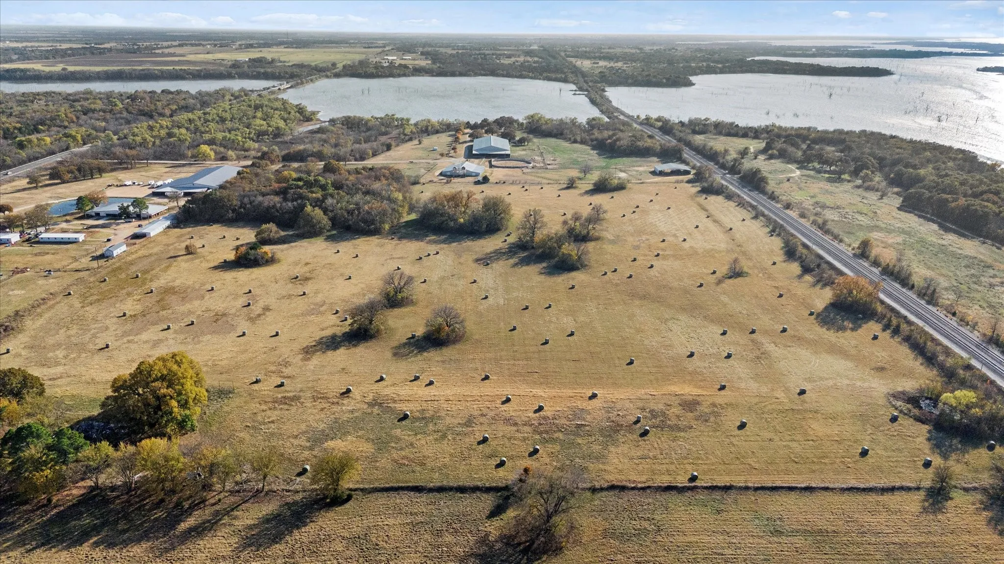 Aerial view of property and surrounding area featuring a large body of water