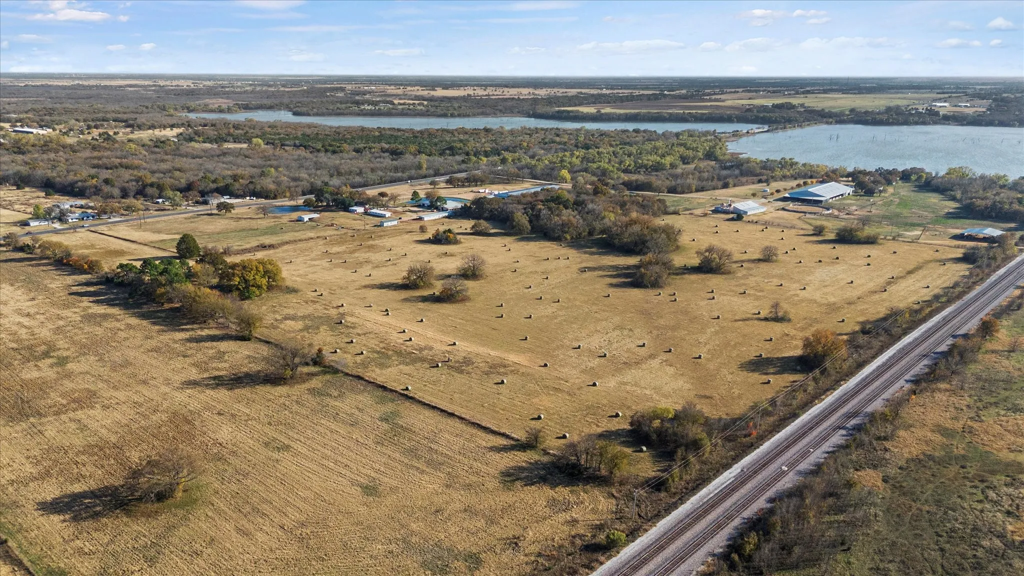 Aerial view of property and surrounding area featuring a large body of water