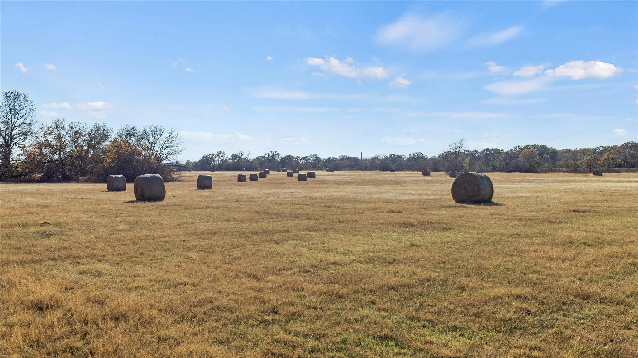 View of green lawn with a view of countryside