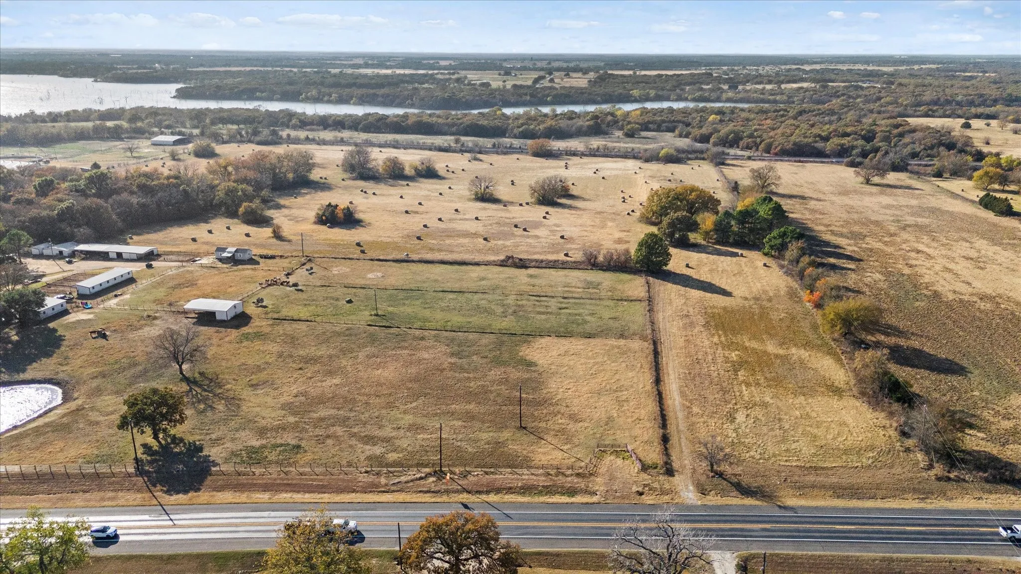 Aerial overview of property's location featuring a nearby body of water and rural landscape
