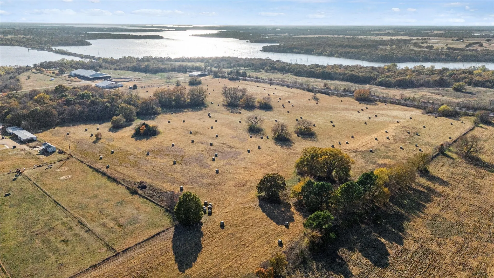 Aerial view of property's location featuring a large body of water