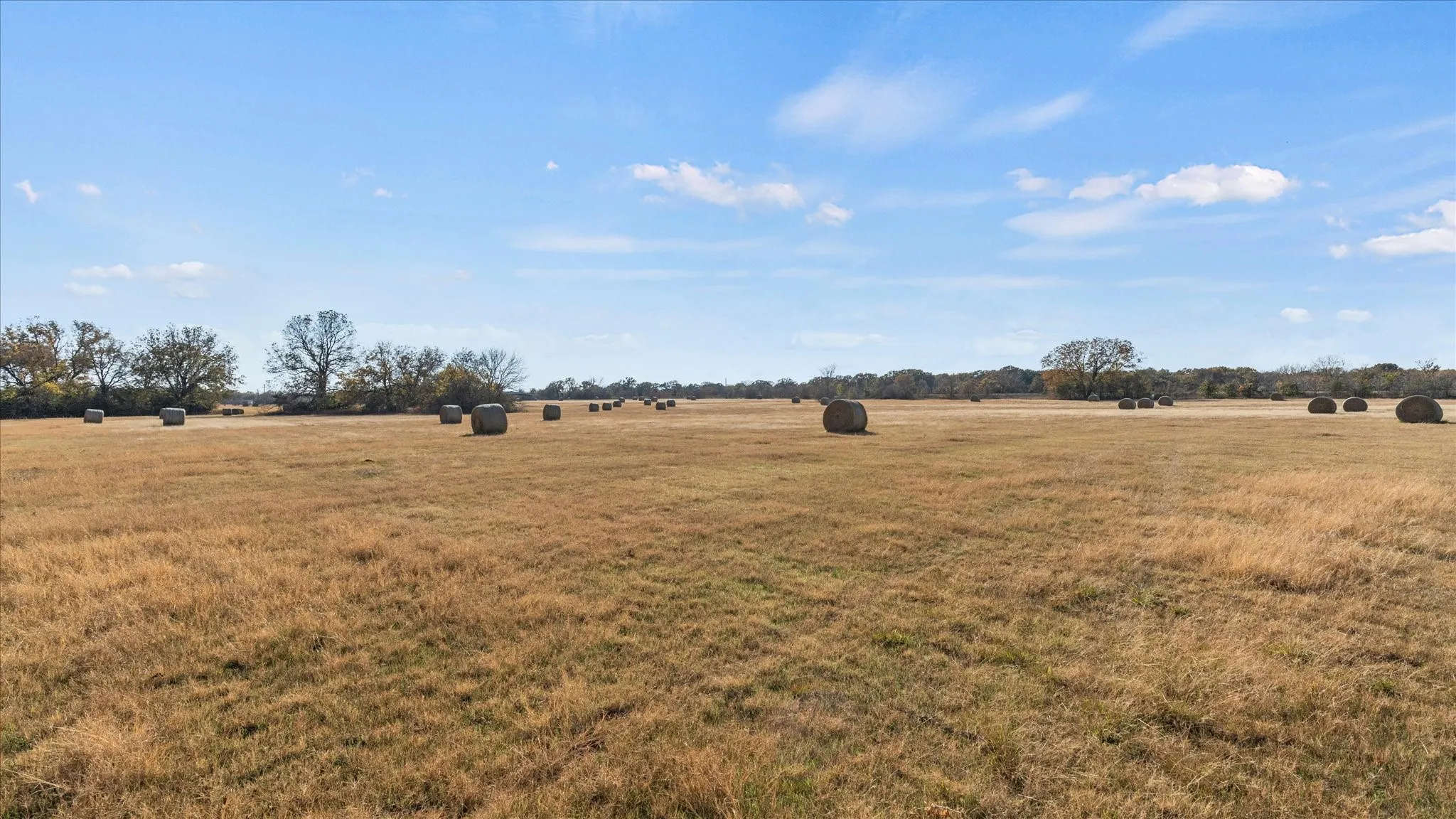 View of green lawn with a view of countryside