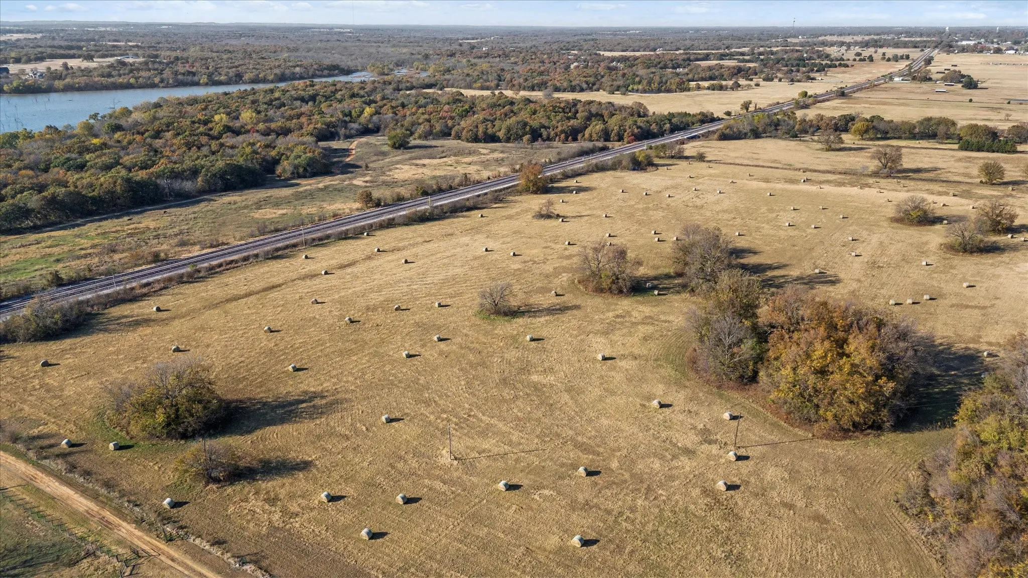 Aerial view of property's location with a large body of water
