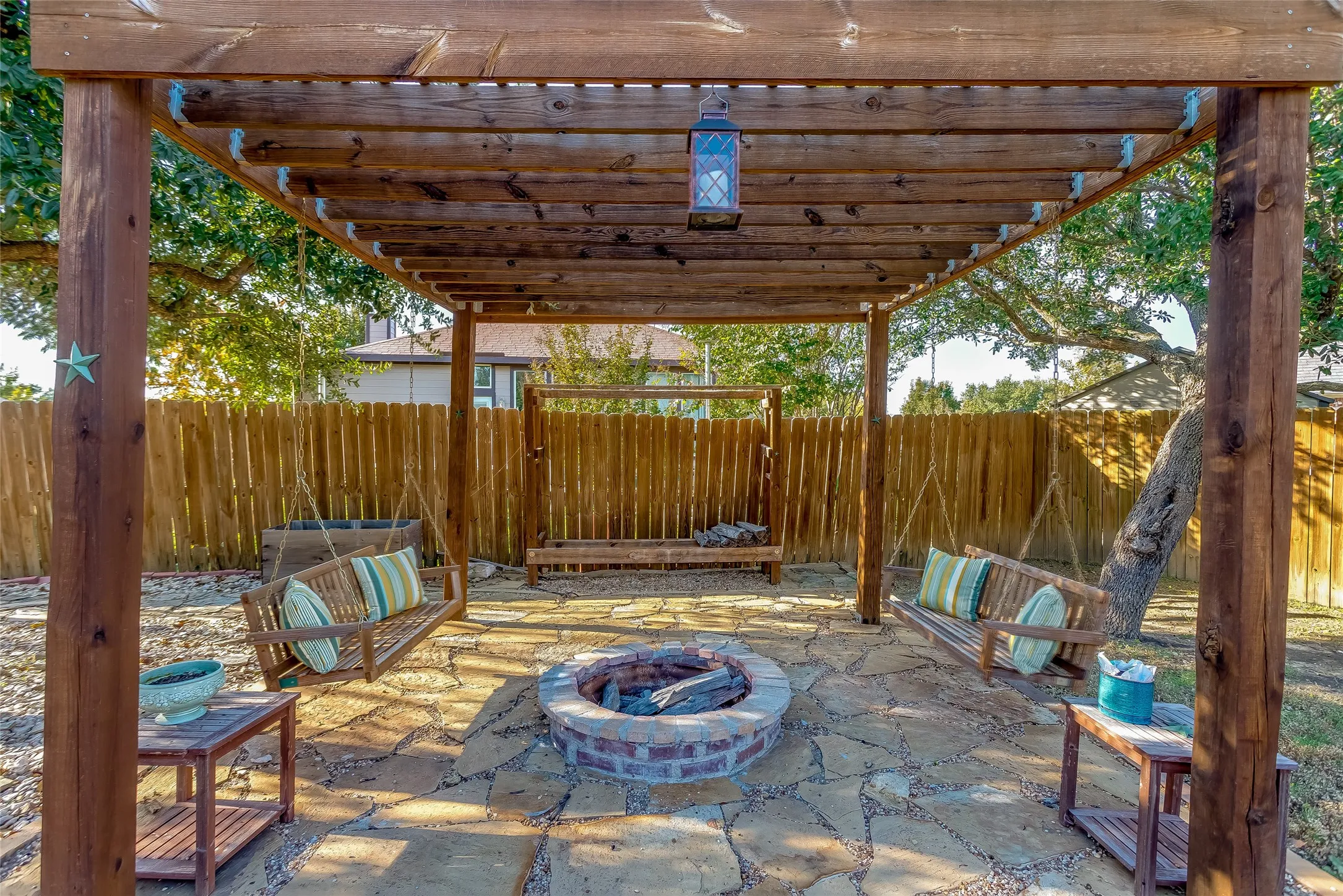 View of patio / terrace featuring a pergola and an outdoor fire pit