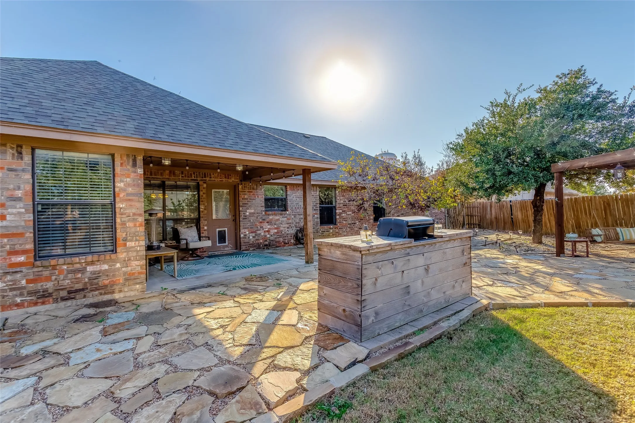 View of patio with exterior kitchen