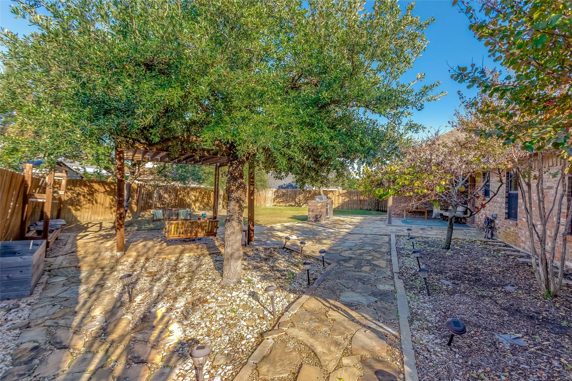 Fenced backyard featuring an outdoor living space and a patio