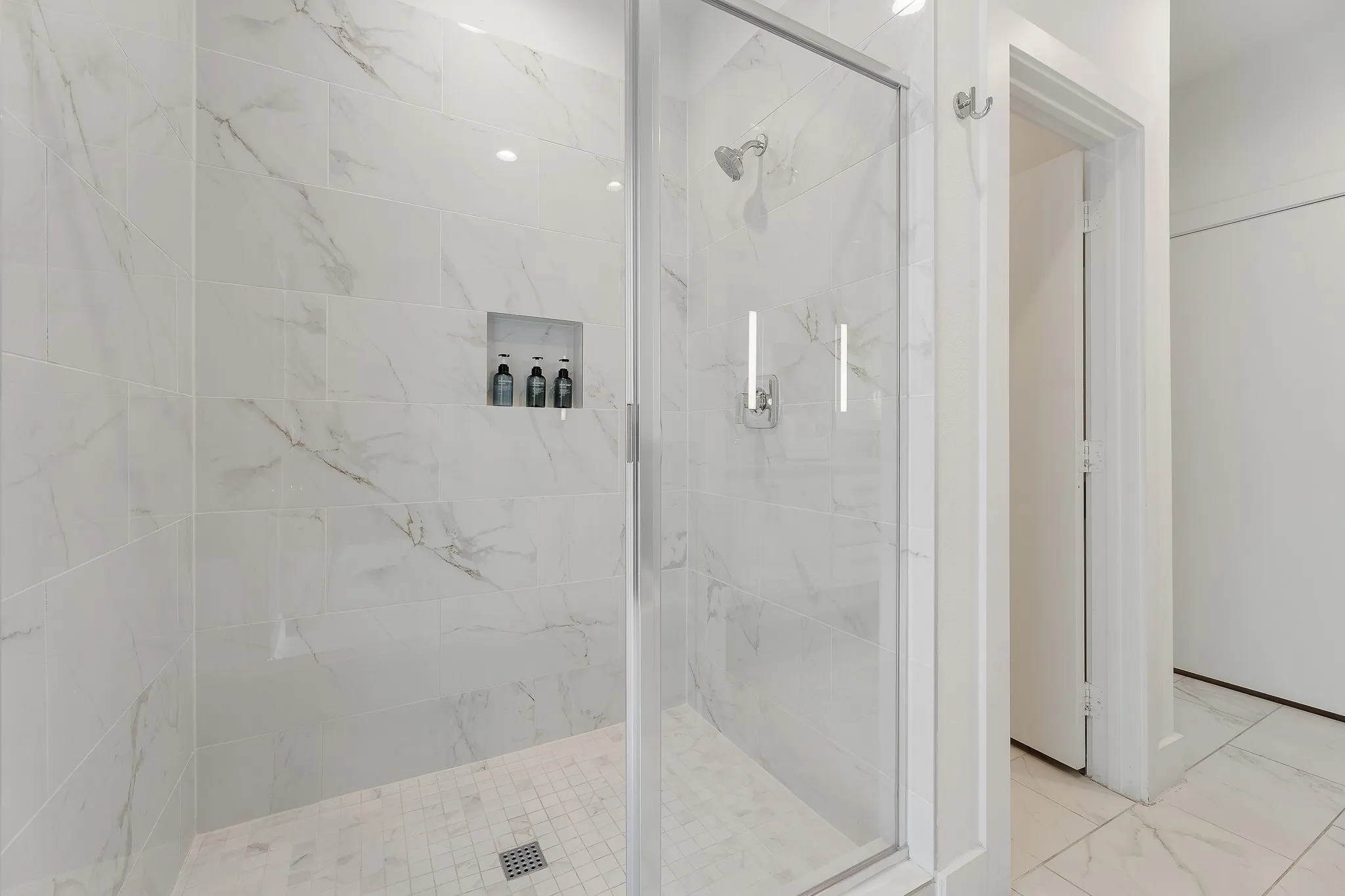Bathroom featuring a marble finish shower and marble finish flooring