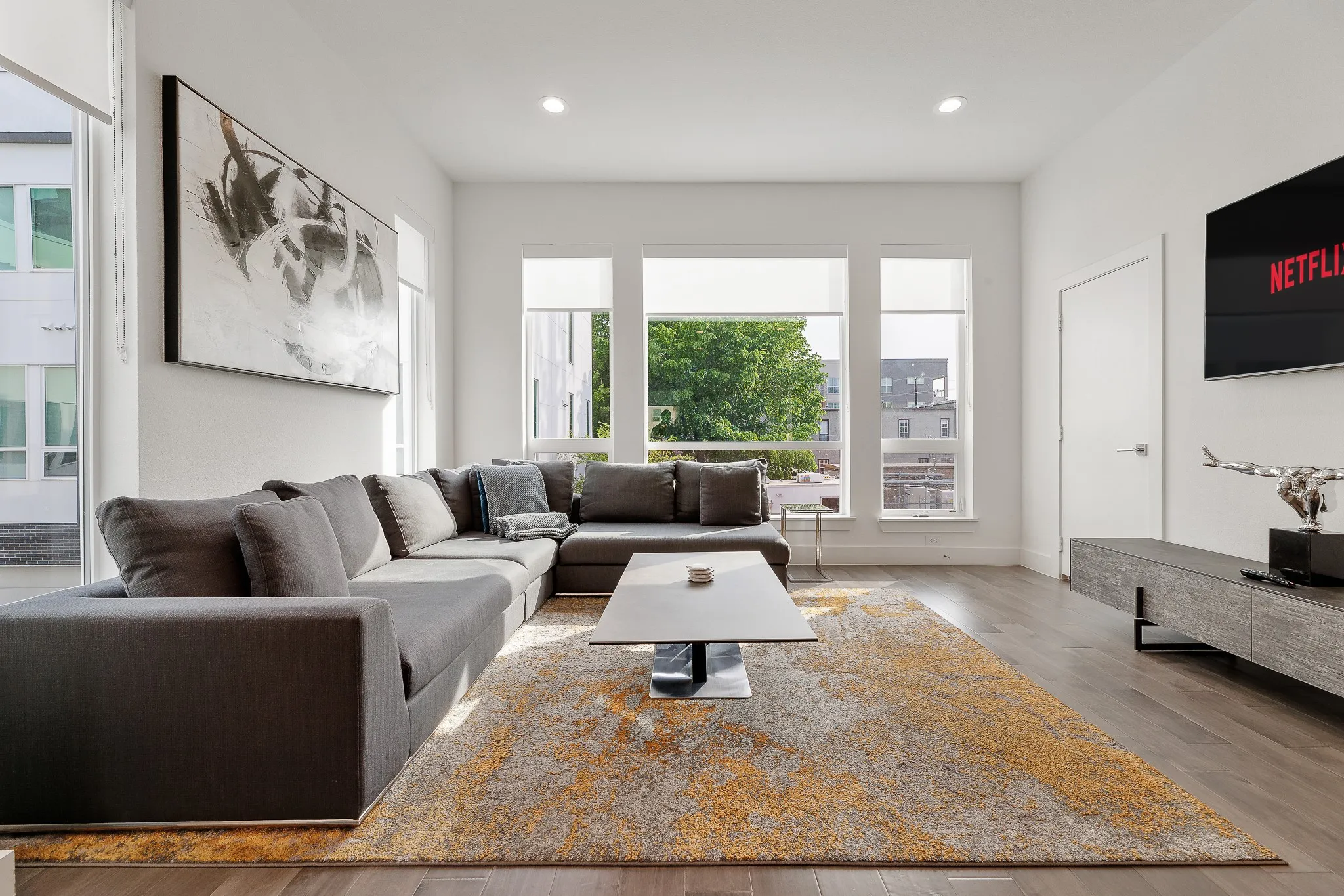 Living room featuring wood finished floors and recessed lighting