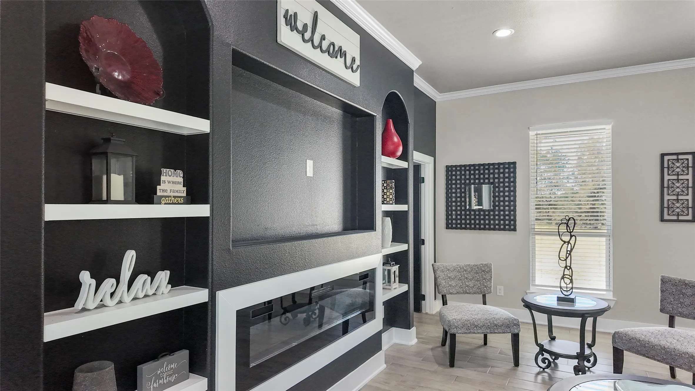 Living area with crown molding, light wood-type flooring, built in features, and recessed lighting
