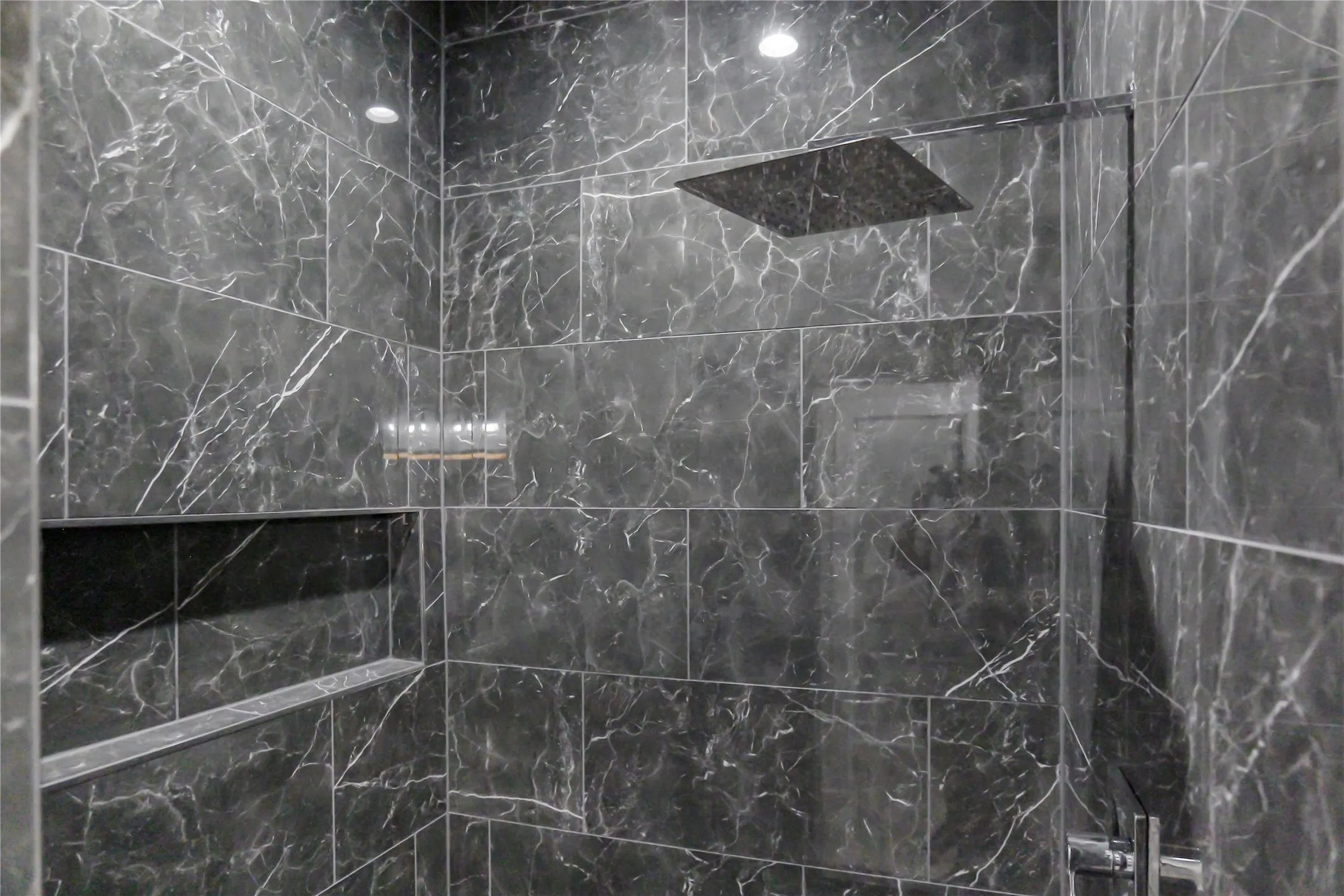 Full bathroom featuring a marble finish shower