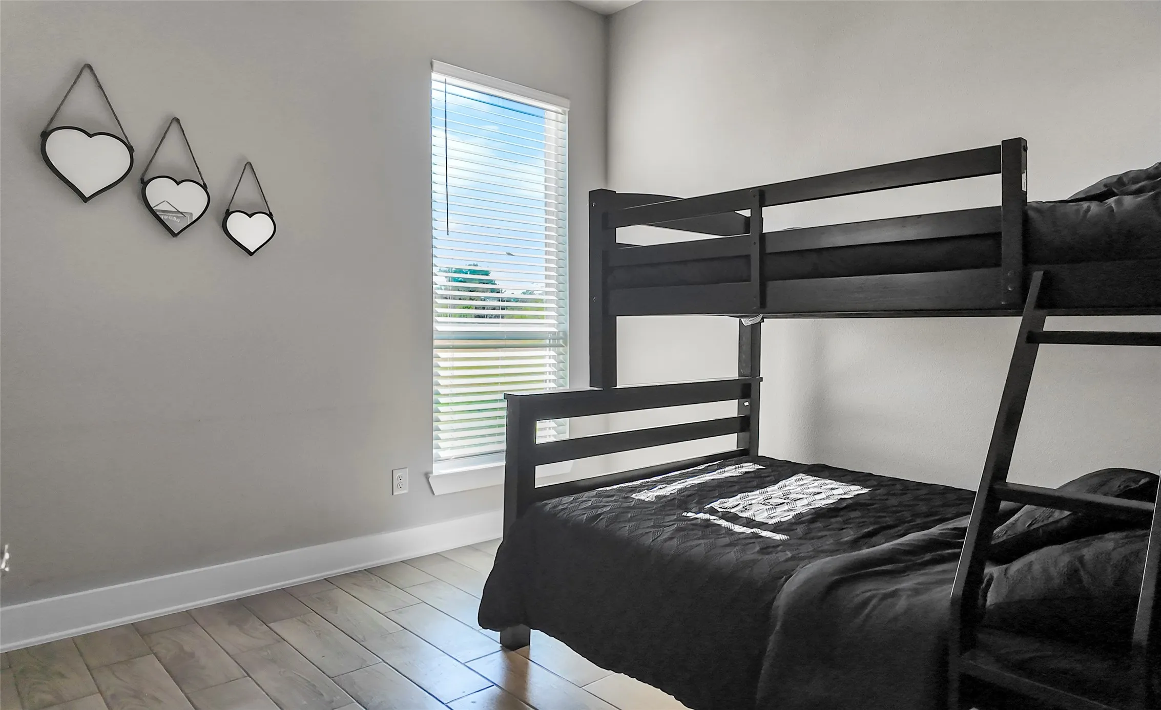 Bedroom featuring baseboards and light wood-type flooring