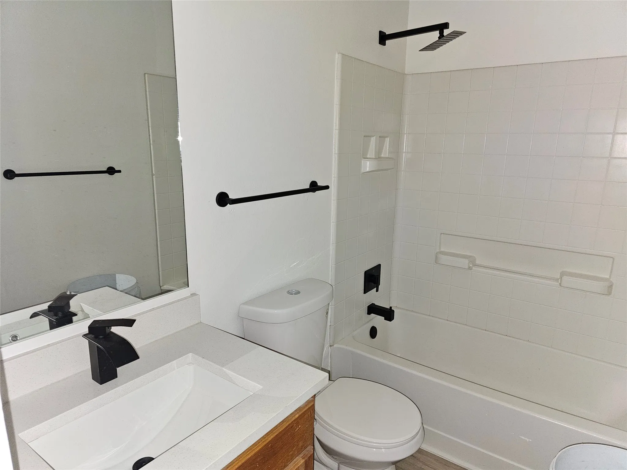 Bathroom featuring vanity and shower / washtub combination