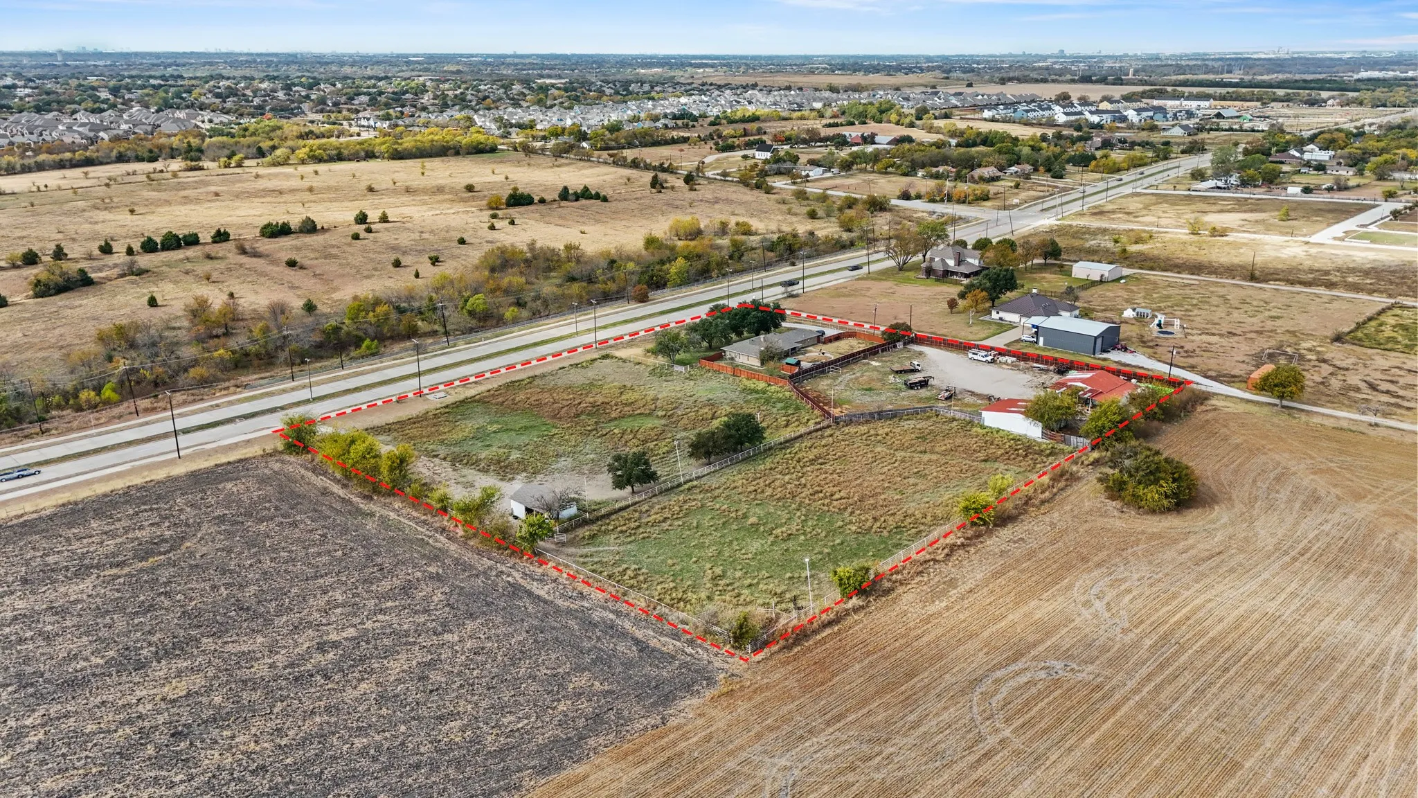 Aerial view of sparsely populated area featuring property boundaries highlighted