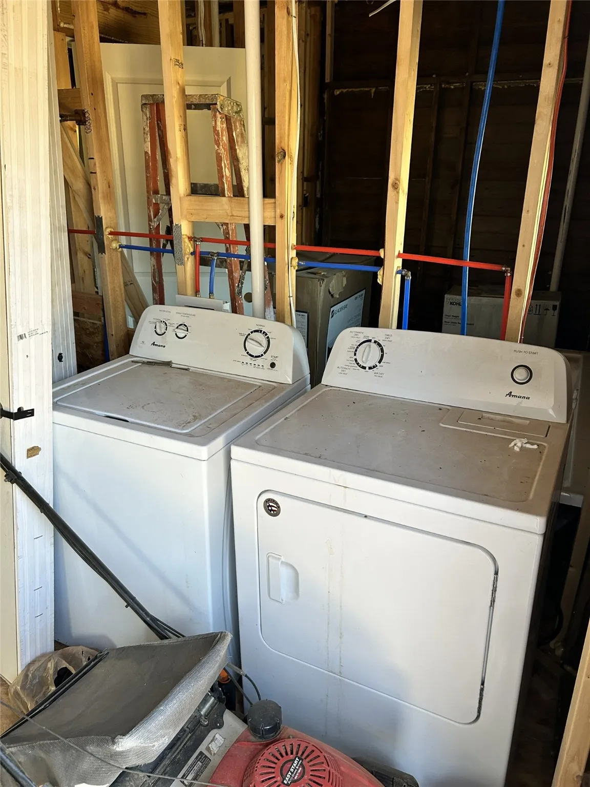 Laundry room with new washer and electric dryer