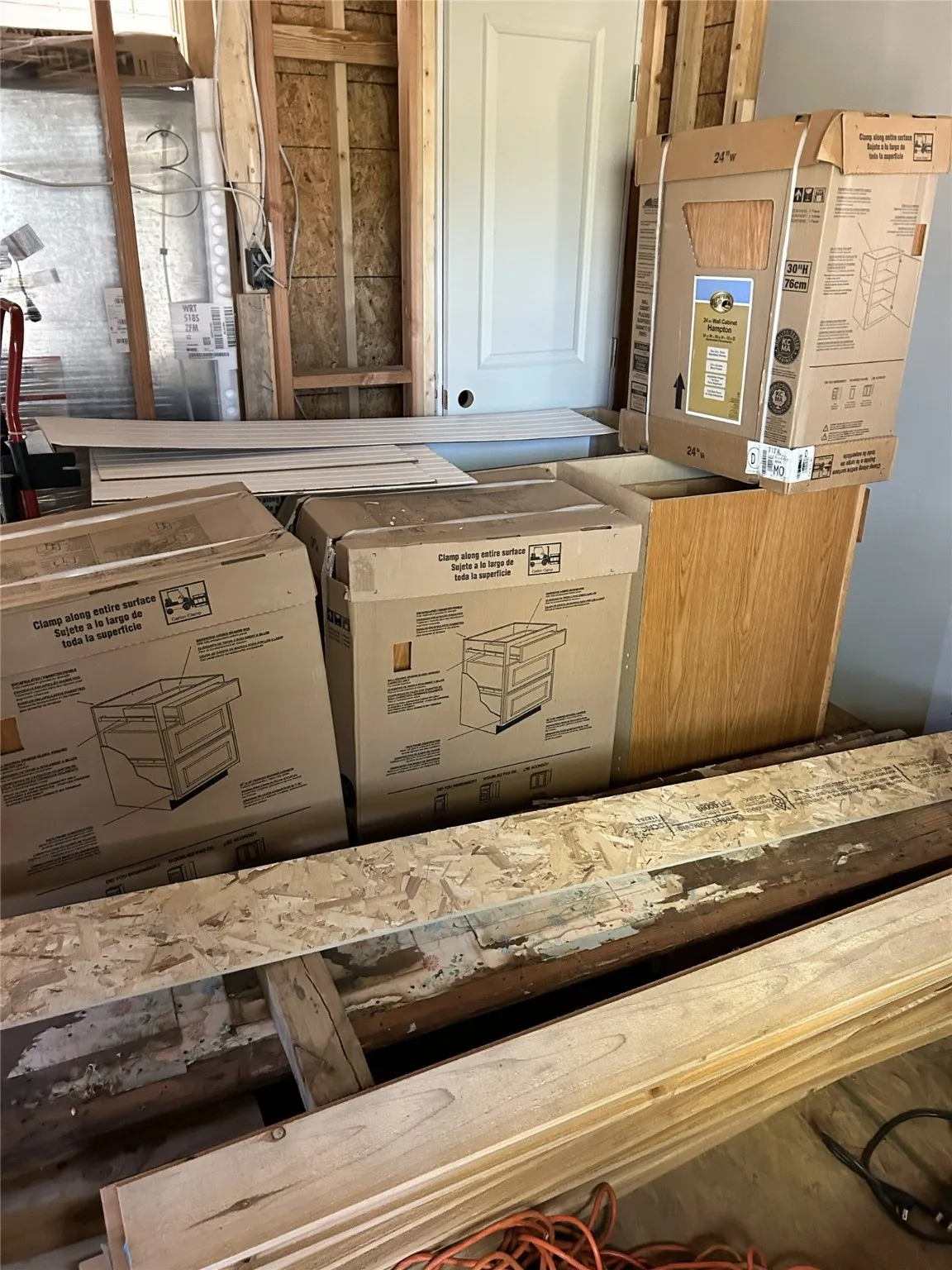 Closet in primary bedroom (with more new cabinetry in the boxes)