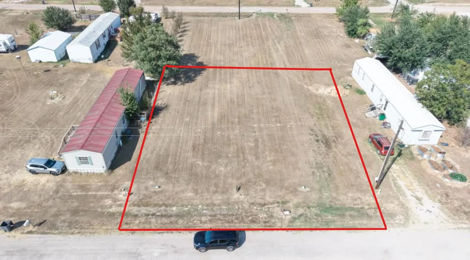 Expansive undeveloped land parcel with cleared, level terrain