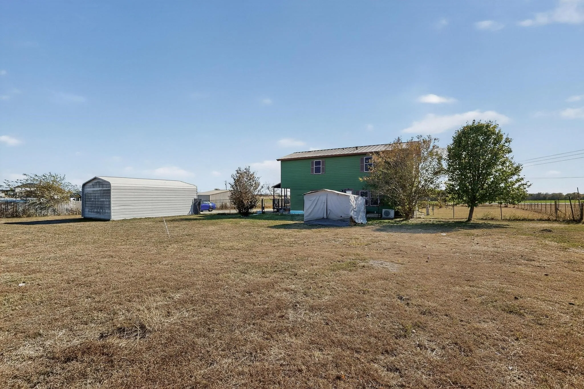 View of yard with a storage shed