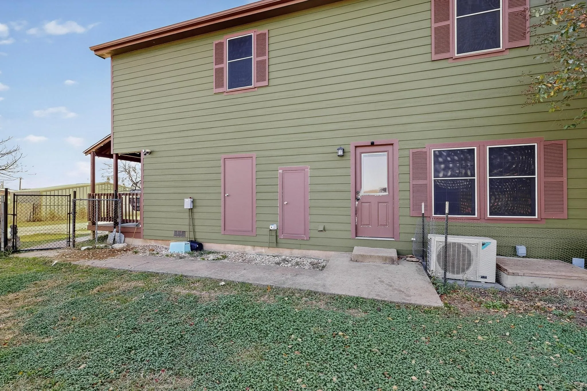 Rear view of property with a gate