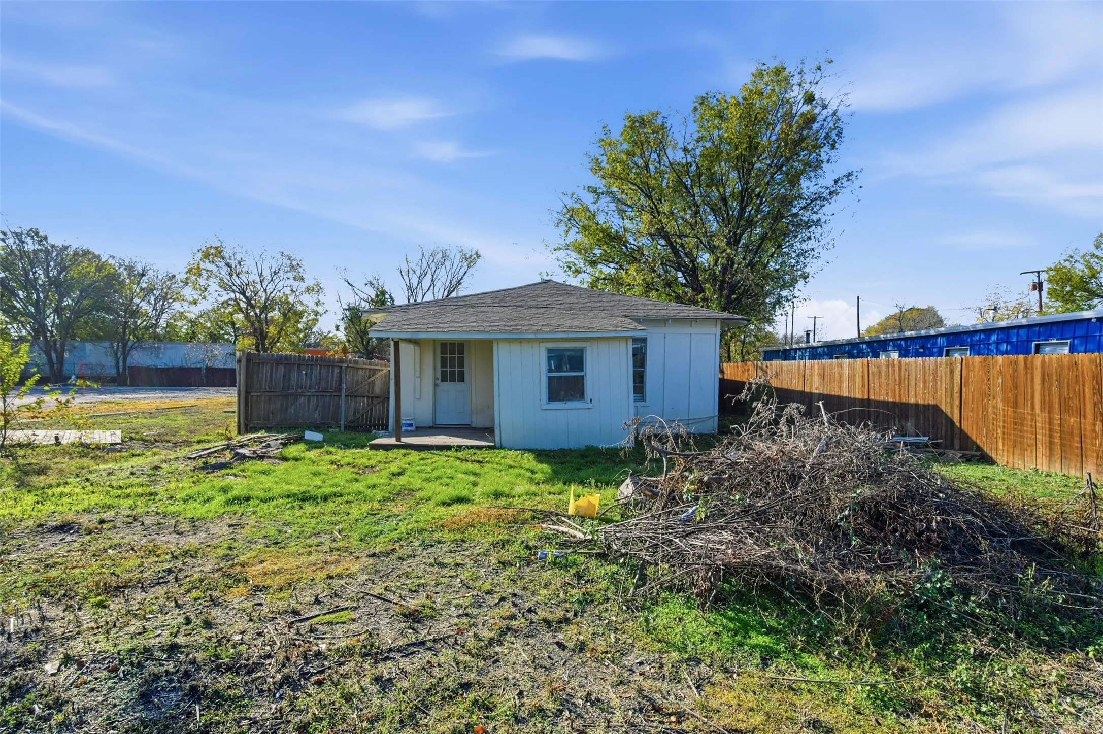 View of outdoor structure with a fenced backyard
