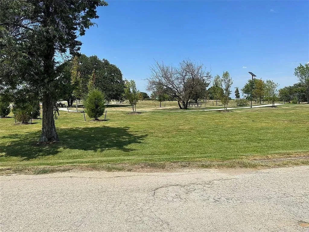 View of community featuring a yard
