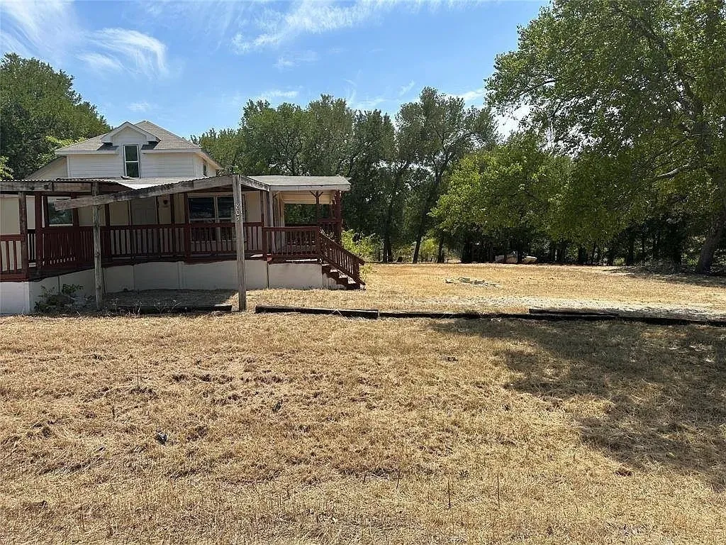 View of yard with a large porch