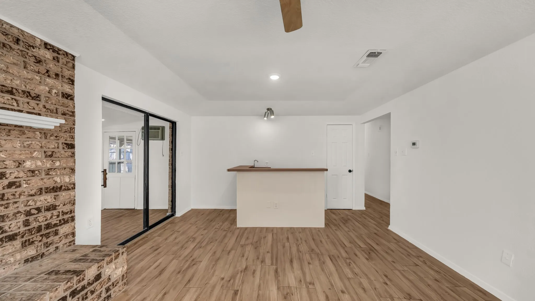Spare room featuring wood finished floors and recessed lighting
