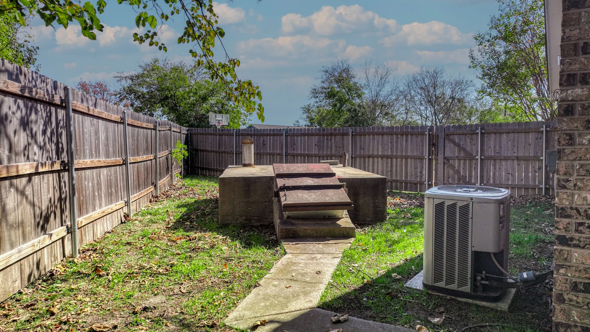 View of fenced backyard