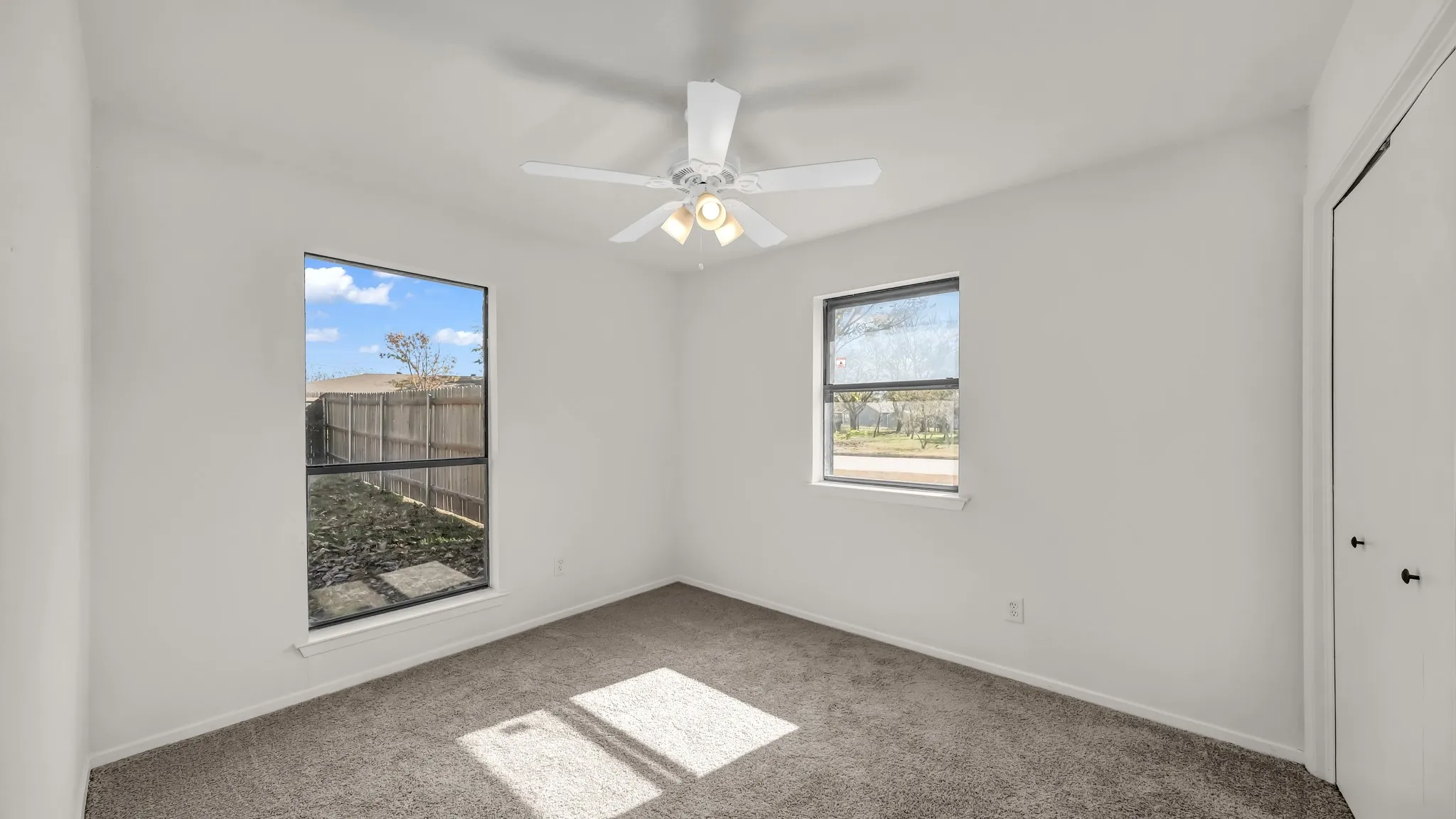 Unfurnished bedroom with carpet flooring, a closet, and ceiling fan