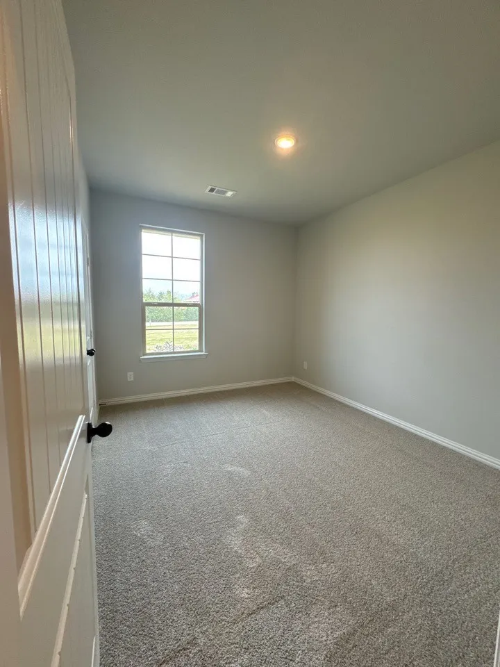 Unfurnished dining area featuring a chandelier and wood tiled floors