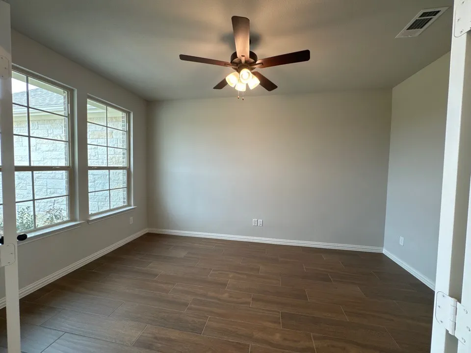 Empty room featuring light carpet and recessed lighting