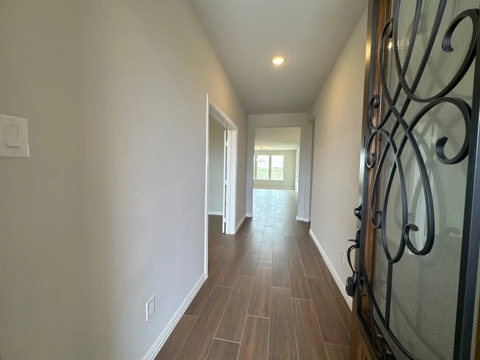 Unfurnished bedroom featuring light carpet and a closet