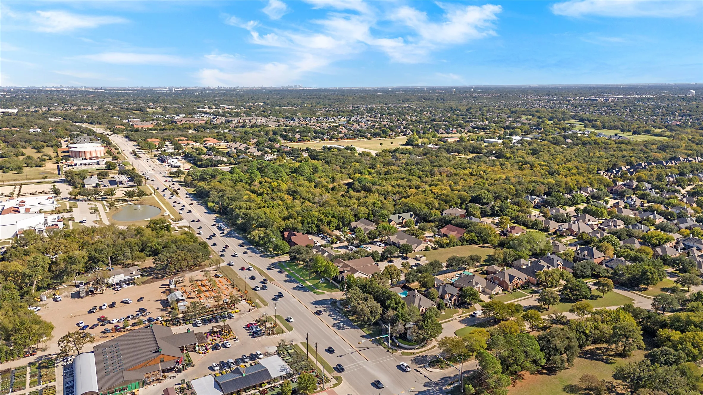 Drone / aerial view of a tree filled landscape