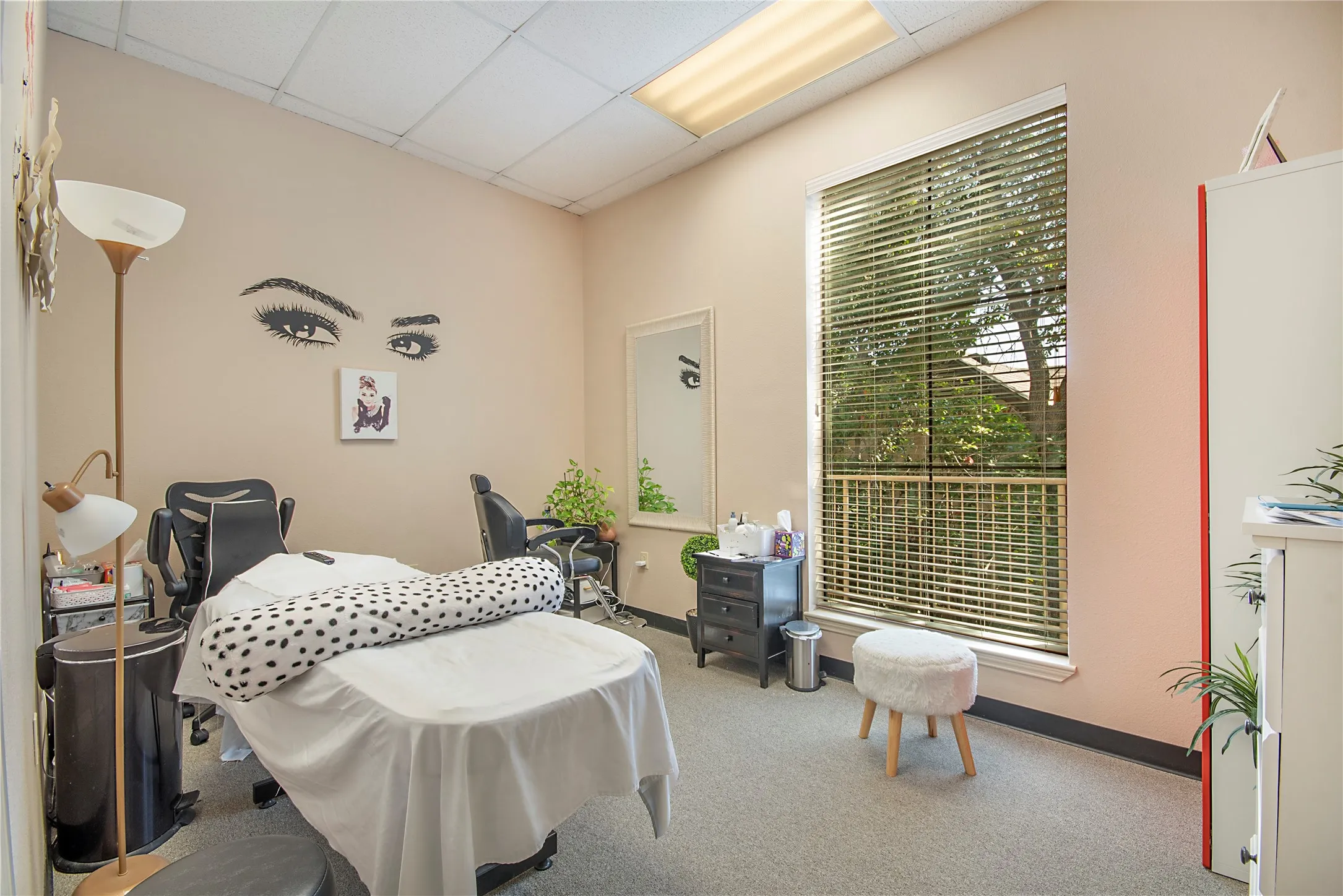 Bedroom featuring a paneled ceiling and carpet flooring