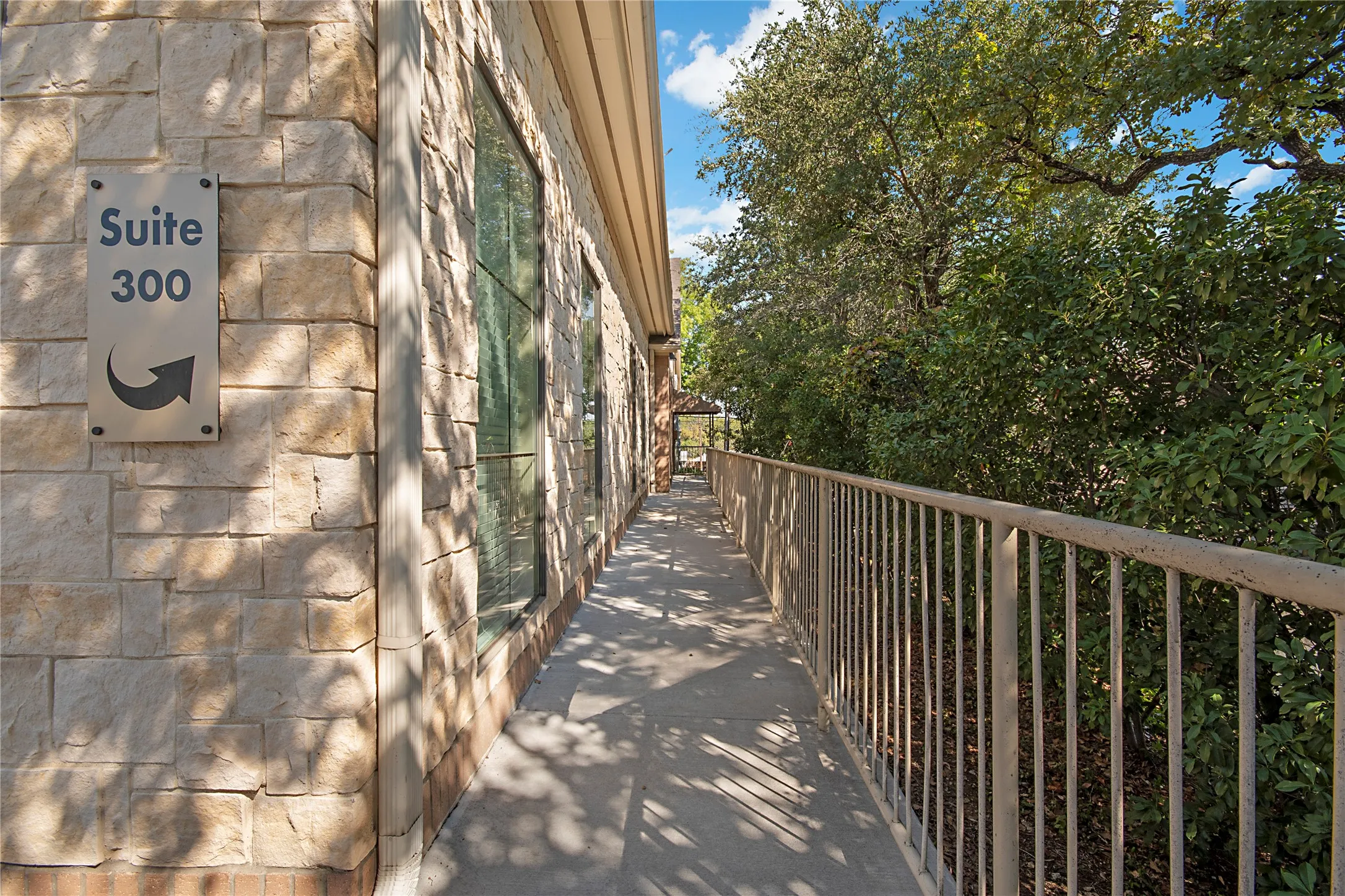 View of side of home with stone siding