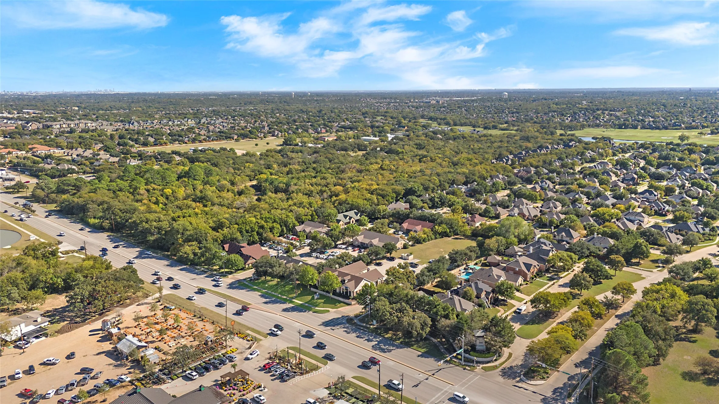 Drone / aerial view of a tree filled landscape