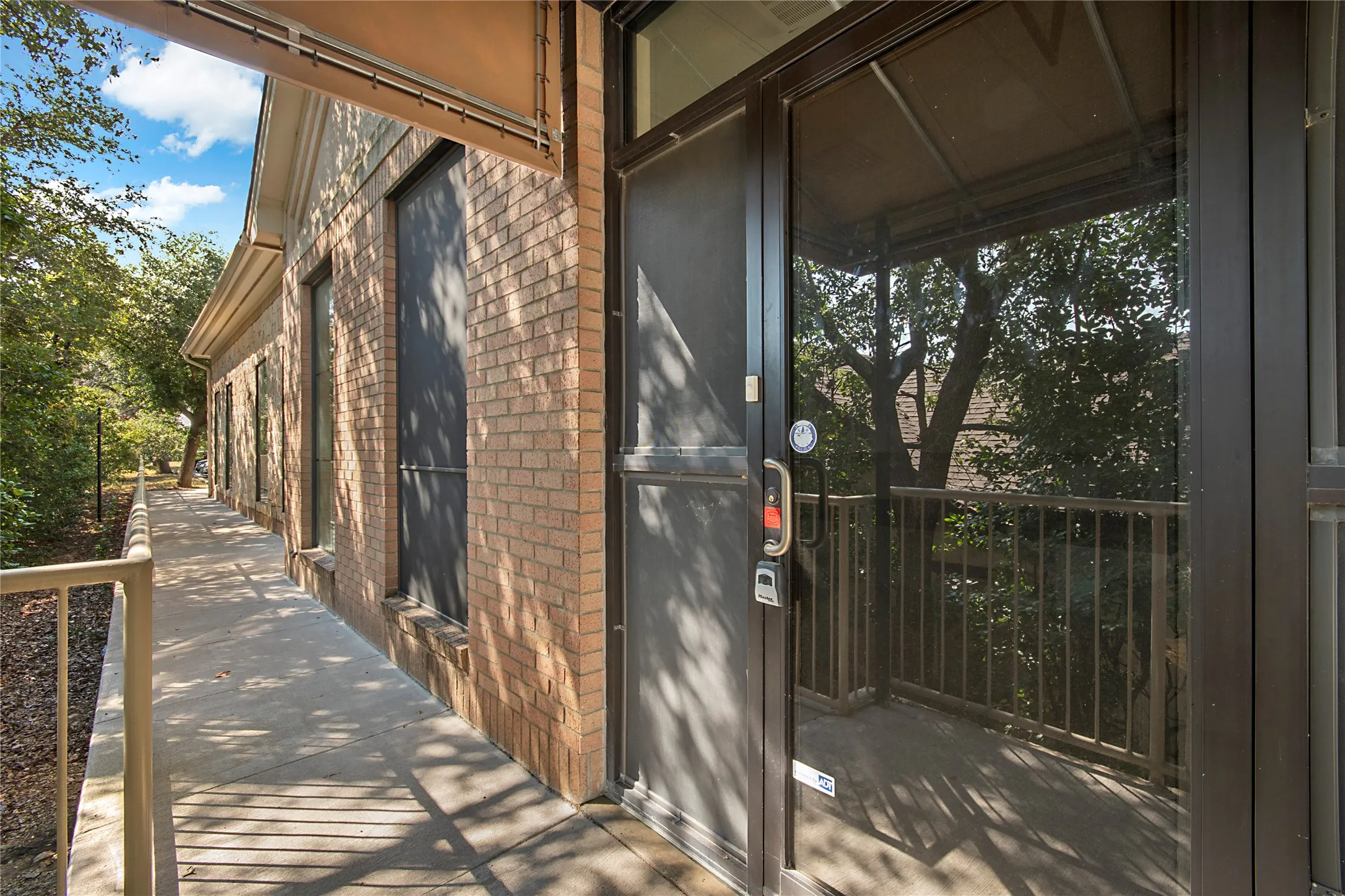 Property entrance with brick siding